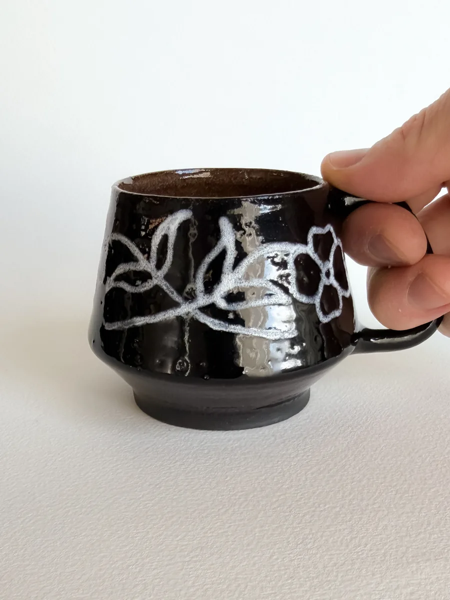 Small mug carved with a poppy