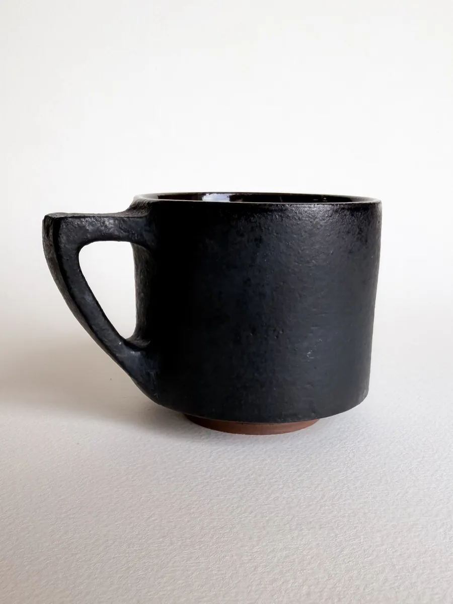 Small matte black seven-sided mug