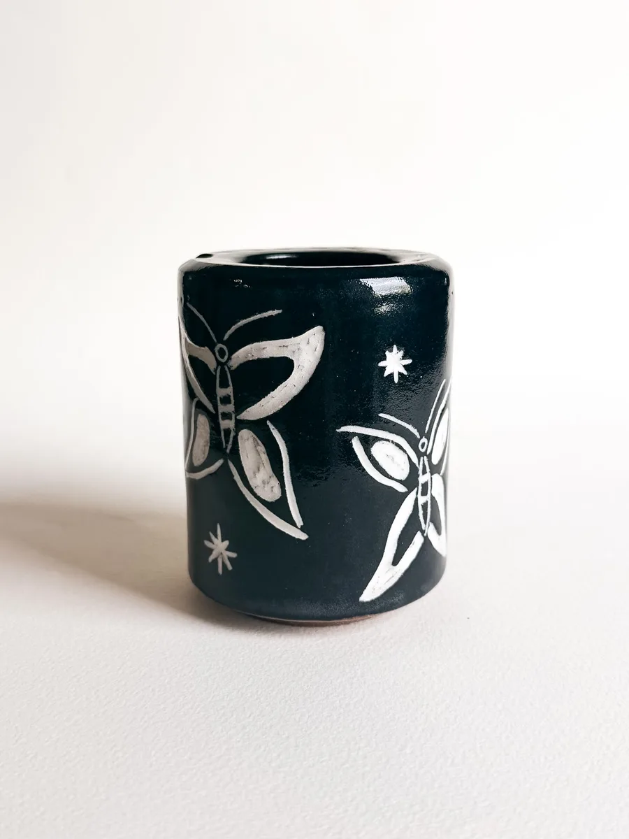 Travel cup carved with butterflies