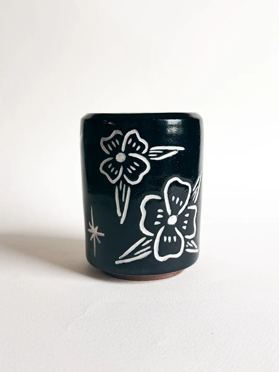 Travel cup carved with poppies