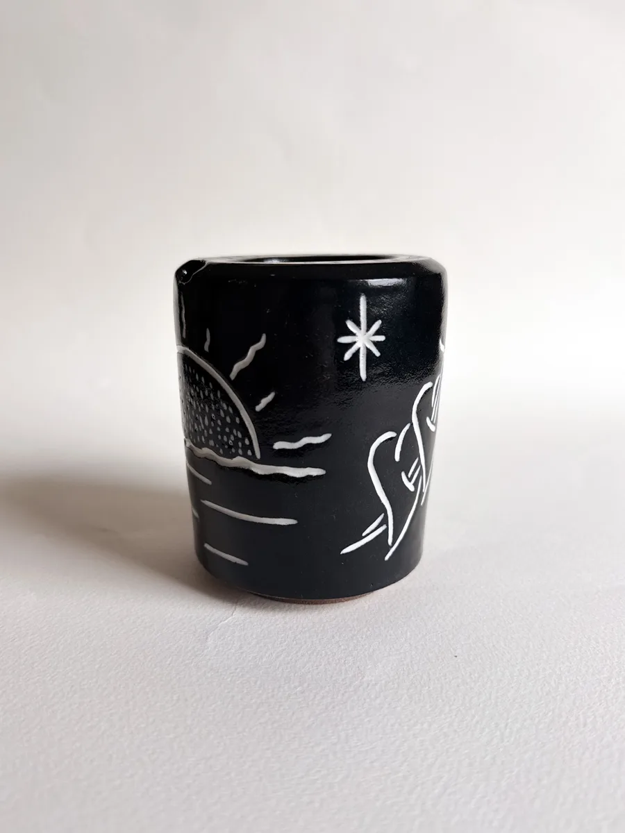 Travel cup carved with a sun and hearts
