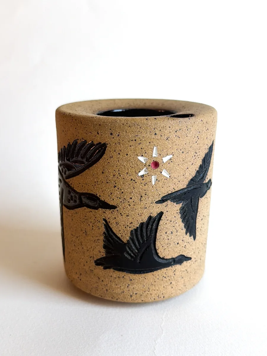 Travel cup with ducks glazed green and dark brown