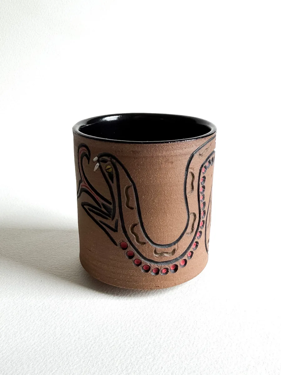 Flash cup with a hand-carved snake