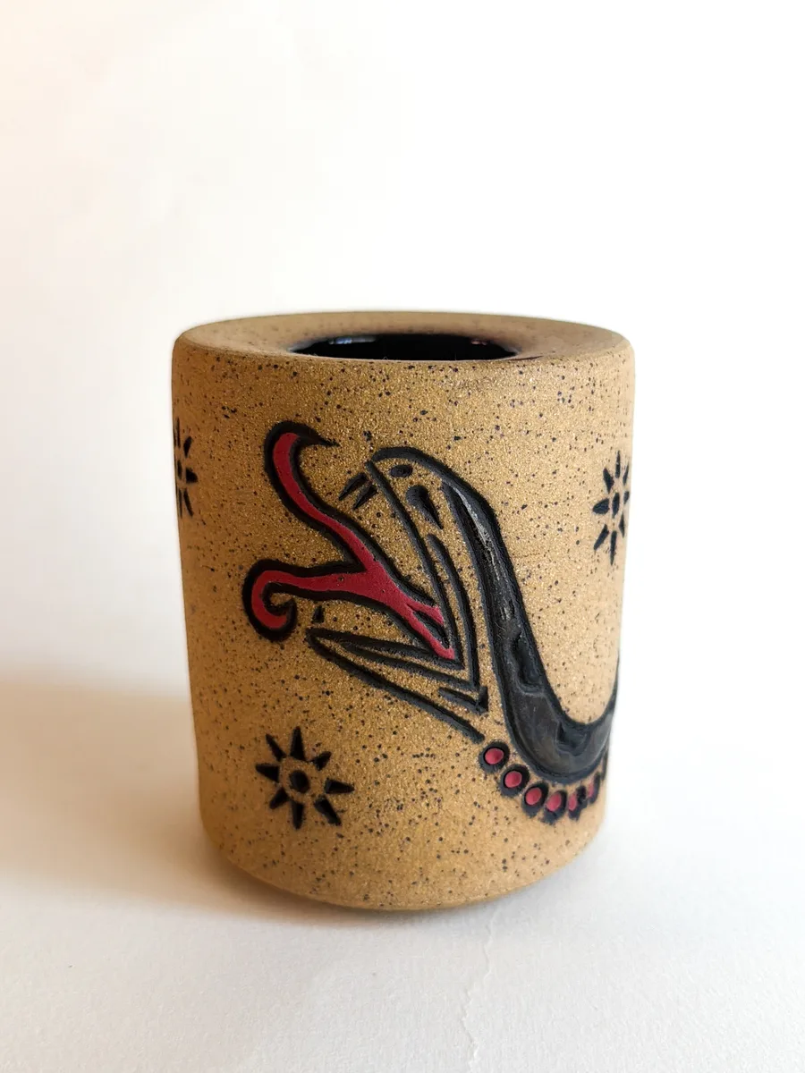 Travel cup with a hand-carved snake, glazed green and dark brown