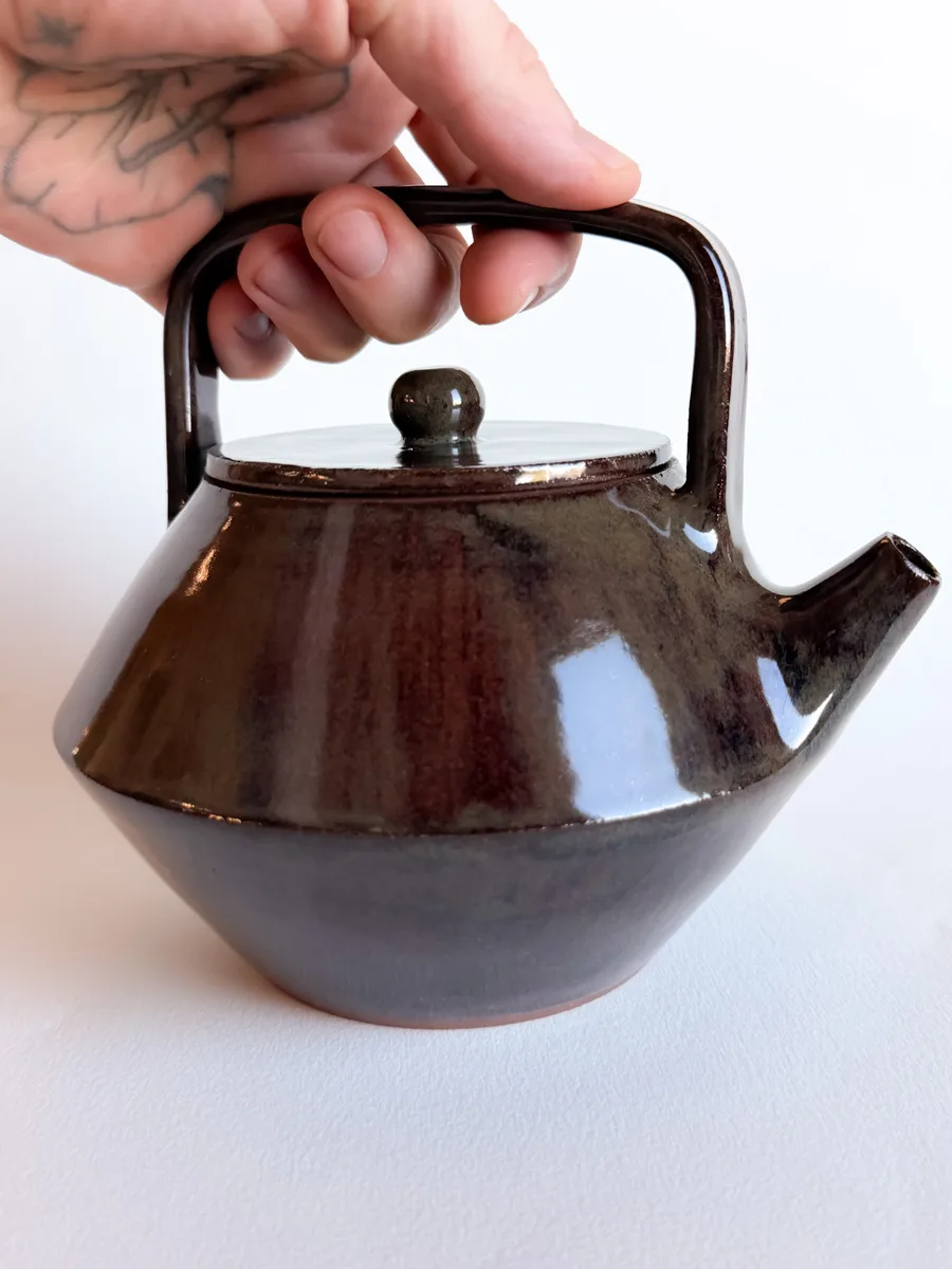 Teapot with a hand-carved surface